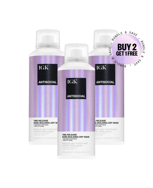 Three bottles of IGK Antisocial Time-Release Bond-Building Dry Mask, each with a purple and white design.