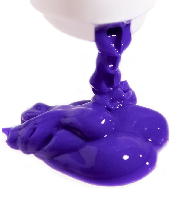 a purple substance flowing from a white container