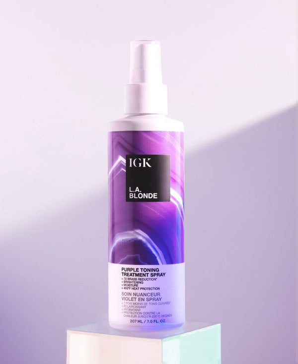 a purple and white bottle of hair treatment