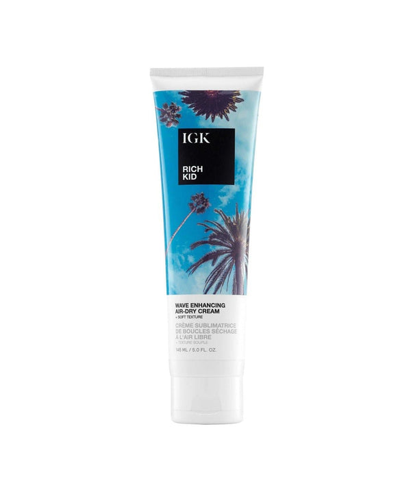 Tube of IGK Rich Kid Wave Enhancing Air-Dry Cream with palm tree design.