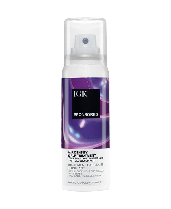 Hair density scalp treatment spray bottle by IGK, with purple abstract design.