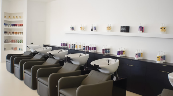 a hair salon with chairs and sink