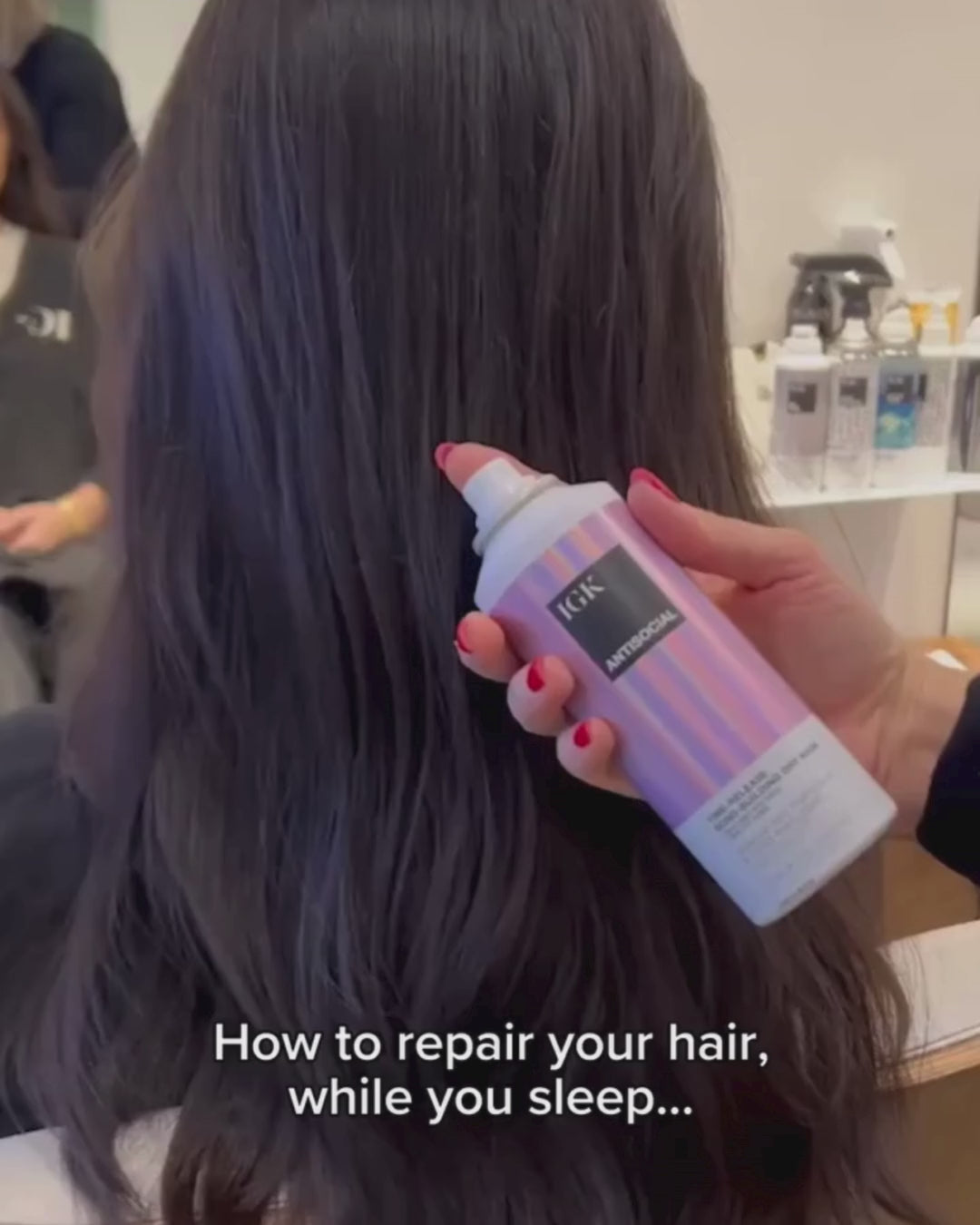 a person spraying hair product