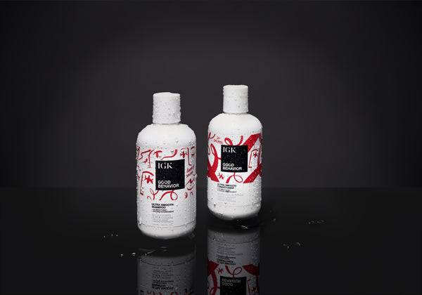 two white bottles with red and white design on them